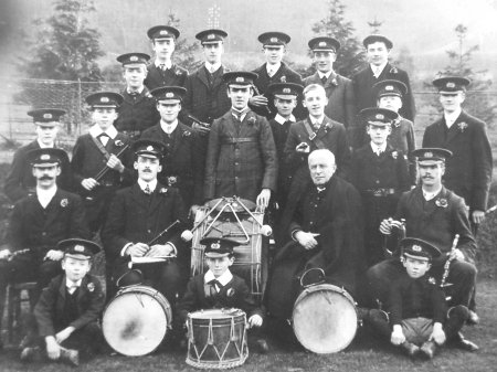 The Reverend Geoffry Hill (seated to the right of the big drum) with the Harnham Fife & Bugle Band.