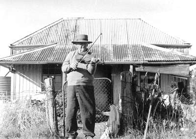 Photo of Charlie outside his cottage