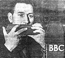 Donald playing his home-made harmonica