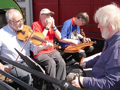 The Band: Brian (fiddle); Geoff (mouth organ); John (mountain dulcimer) and below, left: Nick (cello) in 2011.